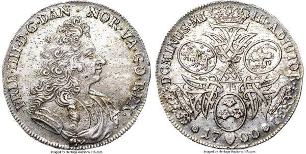 Lot 30259 > Frederik IV Krone 1700-(h) AU58 NGC, Copenhagen mint, KM448, Dav-A1287, Hede-36, Sieg-17. An interesting Danish small crown type that originated in the Eric P. Newman collection and boasts splendid originality. The obverse displays the baroque coiffed portrait of Frederik IV, with the reverse displaying the arms of Denmark, Norway, and Sweden interspersed through crowned monograms, making this one of the more striking designs of the Frederik IV series, beautifully toned in a light lavender with iridescent overtones. There is very light evidence of circulation over the high points of a firm strike, with a number tiny imperfections as is typical of this issue, though far fewer than normally encountered.  Ex. Eric P. Newman Collection (Heritage January Signature Sale 3029, Lot 30480)