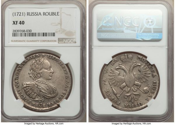 Lot 32721 > Peter I Rouble ΑΨKA (1721) XF40 NGC, Kadashevsky mint, KM157.5, Bit-444. Variety with palm branch on chest and large clover above head. Exhibiting comparatively even and unobtrusive wear across the design with notably few marks or serious visual detractions for the type. 
