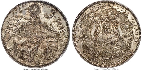 Lot 30308 > Eichstätt - Bishopric. Sede Vacante Taler 1781-KR/OE MS63 PCGS, Nürnberg mint, KM90, Dav-2210. A magnificent choice example of this ever-popular type, argent surfaces alive with hints of aged color in the fields, the devices boldly rendered, each tiny detail of the breathtaking design crisp and palpable to the naked eye. The artistic merit of this piece is self-evident, portraying a three-quarter angle bird's-eye view of the city of Eichstätt, a rare perspective for any coin or medal to entertain and one that serves to provide a complete three-dimensional depiction as opposed to the more common flat two-dimensionality of other 