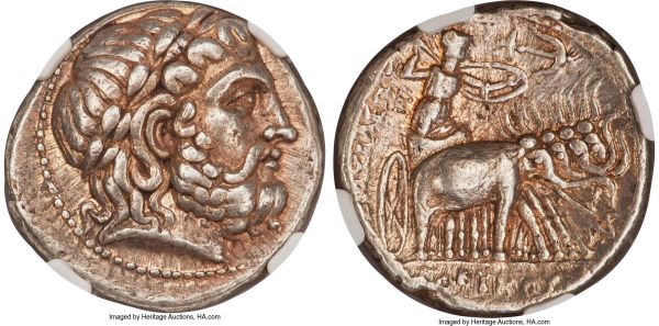 Lot 30083 > SELEUCID KINGDOM. Seleucus I Nicator (312-281 BC). AR tetradrachm (27mm, 17.13 gm, 2h). NGC XF 5/5 - 4/5. Seleucia II (2nd Workshop), from ca. 296/5 BC. Laureate head of Zeus right; dotted border / BAΣIΛEΩΣ / ΣEΛEYKOY, Athena, brandishing spear overhead in right hand, shield on left arm, in car of quadriga pulled by horned elephants right; flanking anchor right above, KPA monogram in inner left field, HIXP monogram to lower right, dotted border. SC 130.17. SNG Fitzwilliam 5511. HGC 9, 18a.