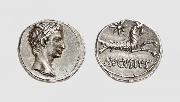 Empire. Augustus. Colonia Patricia. 18-17 BC. AR Denarius (3.88g, 1h). RIC 542; Tradart 4.31 (this coin). Very rare. Old cabinet tone. Exceptional for issue. Among the finest known. Choice extremely fine. From a private collection, acquired from Tradart, Brussels, 1989
 
 The reverse type is the personal seal of Augustus, representing the zodiacal sign with which he was closely associated. It is often described as the sign of his birth (23 September 63 BC). According to Suetonius, the sign of Capricorn became important to the future Augustus already in 44 BC, just after the murder of Caesar. At this time, he and his close lieutenant, Marcus Agrippa, had their horoscopes cast by a Greek astrologer. Agrippa went first and had amazing things predicted of him. Octavian feared that his future could not possibly be as impressive as Agrippa’s and initially resisted having his horoscope cast, but when he relented the astrologer bowed and recognized him as the future master of the Mediterranean world