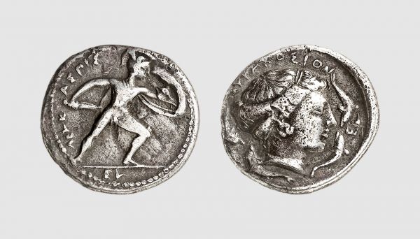 Sicily. Syracuse. 415-405 BC. AR Drachm (4.08g, 9h). Signed work by the Master Eumenos. Baldus 3; Rizzo 42.9 (same dies). Very rare. Less than ten known. Old cabinet tone. A charming coin. Good very fine. From a private collection; Münzen & Medaillen 1986 (68) lot 154