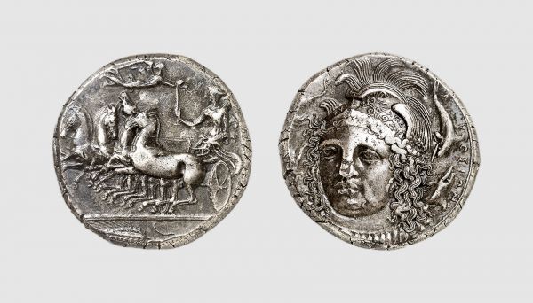 Sicily. Syracuse. 415-405 BC. AR Tetradrachm (16.97g, 9h). Reverse die signed by the master Eukleidas. Fischer-Bossert 58 (same dies); Kraay-Hirmer 111 (same dies). Very rare. Old cabinet tone. An important and innovative coin of a magnificent classical style. One of the most successful facing heads in all of Greek coinage. Insignificant metal flaw and die breaks, otherwise, choice extremely fine. From a private collection; acquired from Tradart, Brussels, 1990
 
 Eukleidas is perhaps less well known than his contemporaries Kimon and Euainetos, but he was undoubtedly the most imaginative and bold of the three great Syracusan artists working at the end of the fifth century. His signature appears in very small letters on the helmet of the head of Athena. This is one of the most successful facing heads to appear on contemporary coinage; though the engraving of the die has no great depth, Eukleidas has created a very three dimensional head, partly by devices such as having the tail of the dolphin on the right disappear behind the head. This was one of the many contemporary Syracusan coins which were enjoyed throughout the Greek world, as imitations as far away as Lycia show