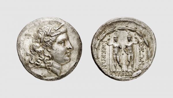 Mysia. Pergamum (?). 145-140 BC. AR Stephanophoric Tetradrachm (16.74g, 12h). Meadows 2013, 184-191; Nicolet-Pierre & Amandry 11 (this coin). Very rare. Lightly toned. Among the finest known of this intriguing issue. Choice extremely fine. From a private collection; Frank Sternberg 1986 (17) lot 124
 
 This issue had long been attributed to the island of Syros based on the reverse legend... Recent scholarship, however, has convincingly shown that this attribution is erroneous, as the reverse legend does not contain an ethnic, but names the type: the Divine Syrian Kaberioi. As the issue has long been linked to a very rare portrait emission of Eumenes with the same reverse type, it is clear that it must belong to a mint in the sphere of the kings of Pergamum. Although this Attic-standard issue could have been struck at one of several mints under Attalid control, it is tempting to attribute it to the royal mint at Pergamum