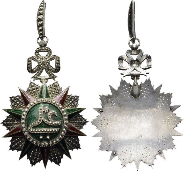 Order of Glory (Nishan Iftikhar). Grand cordon or commander's badge in silver and enamel, with cypher of Ali Bey (1882-1902), 63x91 mm (without rings). Gritzner p. 580-581. AR. 75.40 g. VF Fine manufacture, probably French, small enamel defects, no ribbon. 