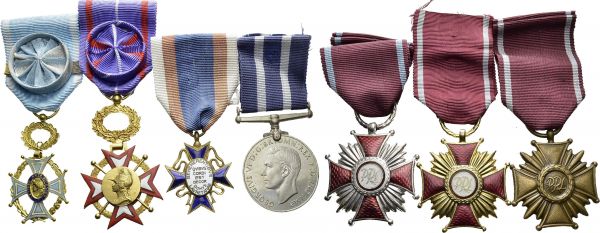 Lot of decorations and medals including : 1. Poland, three crosses of Merit in gold (gilt), silver (silvered) and bronze, in cases. 2. Great Britain, WW2. Italy, Africa and 1939-1945 stars, plus a War Medal. 3. Italy. Two fascist badges and a cross 